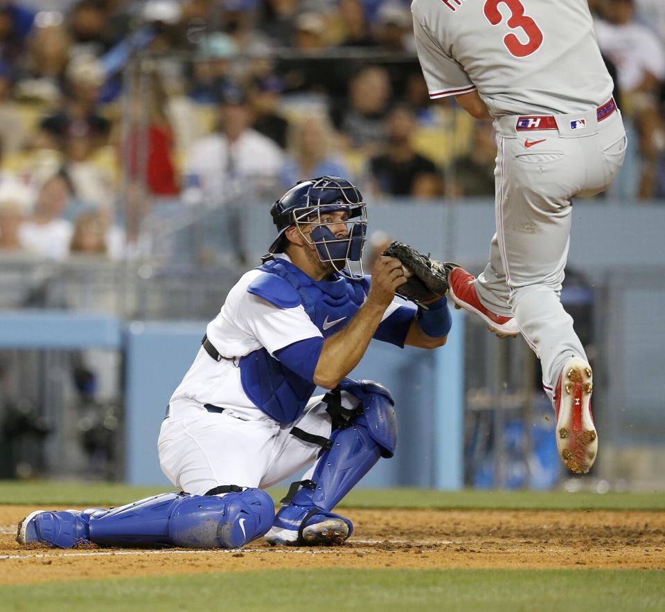 Dodgers catcher Austin Barnes tags out Phillies Bryce Harper in the sixth inning.