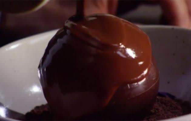 Everyone holds their breath as Colin pours over the chocolate sauce. Source: Channel Seven