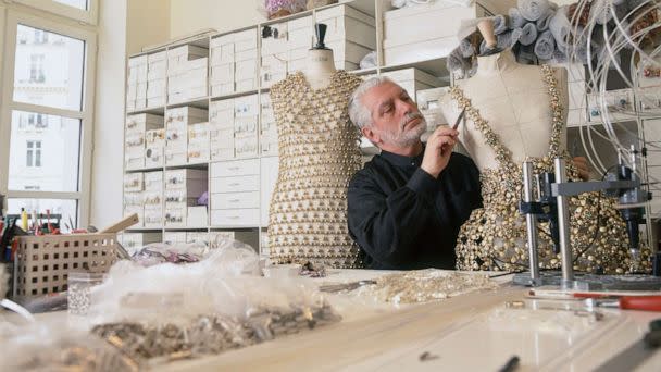 PHOTO: Fashion designer Paco Rabanne works on an outfit in his Paris workshop, April 11, 1996. (Eric Robert/Getty Images, FILE)