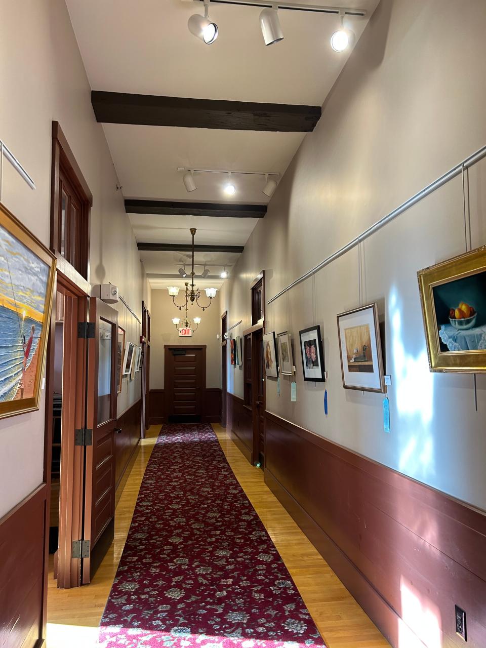 Paintings from members of the Sandwich Arts Alliance line the halls of their new home at the old Sandwich Town Hall.