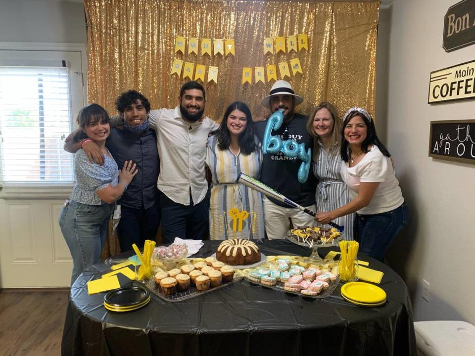 (from left to right) Pamela Ly Anglero, Esteban Vilchez, Marco Vilchez Jr., Erika Vilchez, Marco Vilchez, Joann Burgess and Tamara Mendoza smile at the gender reveal party for Marco Jr. and Erika’s baby. Family said Mendoza, who died in the Feb. 11 pileup crash on I-35 in Fort Worth, made an effort to connect with family she hadn’t seen in years.