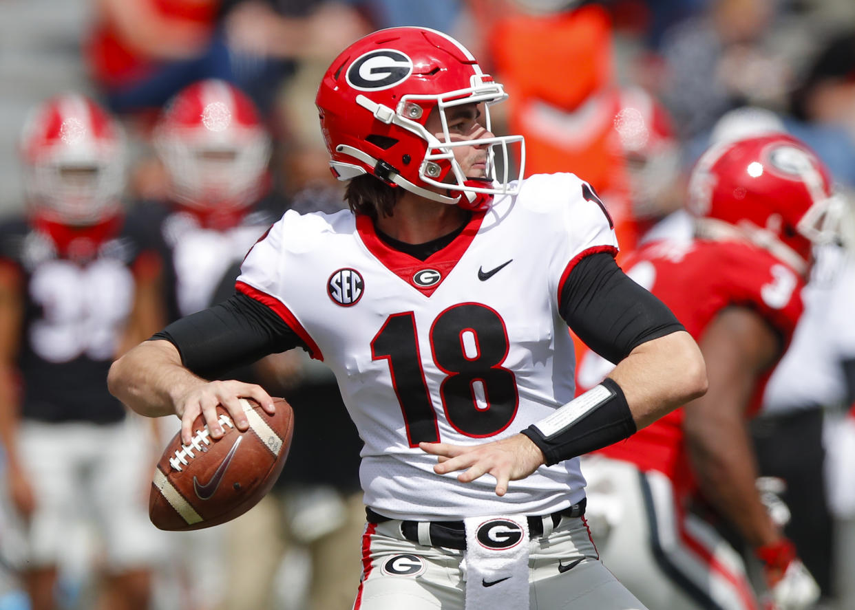 ATHENS, GA - APRIL 17: Quarterback JT Daniels #18 of the Georgia Bulldogs drops back to pass during the second half of the G-Day spring game at Sanford Stadium on April 17, 2021 in Athens, Georgia. (Photo by Todd Kirkland/Getty Images)