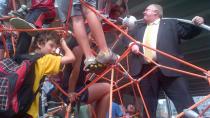 Toronto Mayor Rob Ford scales the climbing apparatus at the newly open Underpass Park under the Gardiner Expressway in Toronto.