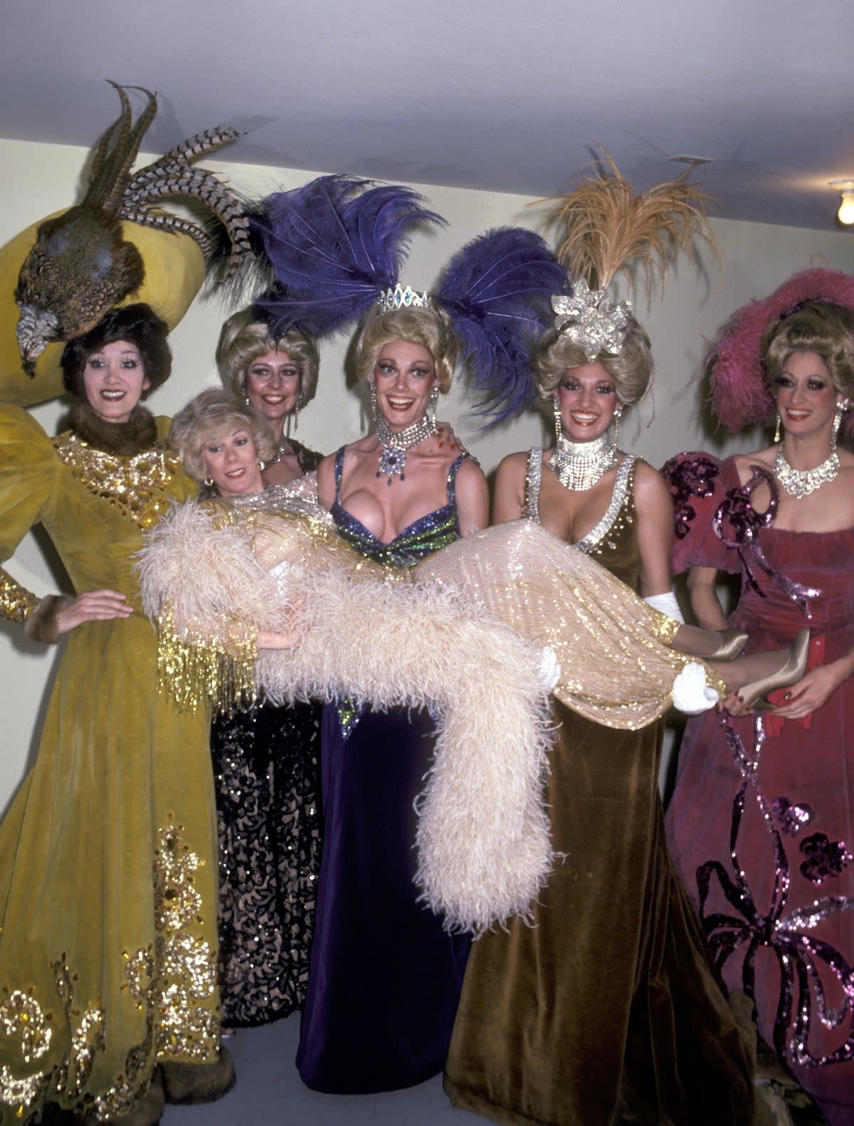 Joan Rivers, one of the many famous faces to grace the Tropicana, poses with Folies Bergere showgirls; singers like Frank Sinatra numbered among other star performers, while the Trop also featured as a Rat Pack hangout (Ron Galella Collection/Getty)