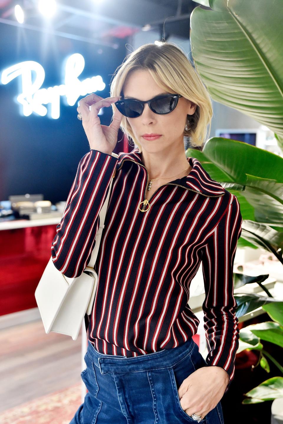 Jaime King tries out some new sunglasses at the Ray-Ban store opening in Venice, California, on Thursday.