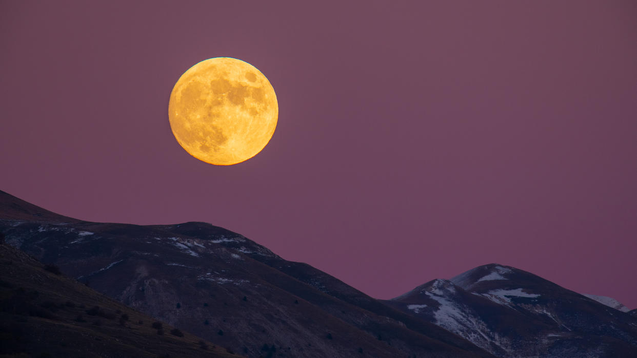  Beaver moon rising behind Gran Sasso dItalia picks is seen from LAquila, Italy, on November 7, 2022. November full moon takes this name because during this month beavers fill the banks of rivers and build their dams and dens to take refuge in view of winter. On november 8, 2022, the moon will be in its last total eclipse before 2025. 