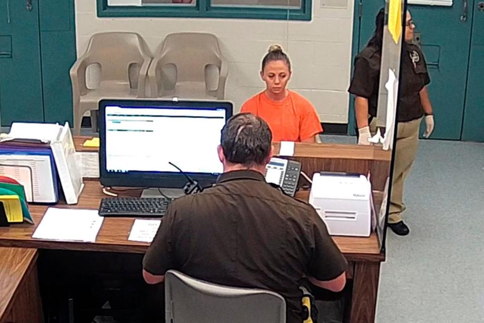 Footage from police showed Dallas police Officer Amber Guyger being booked at the Kaufman County Sheriff's Office after turning herself in. (AP)