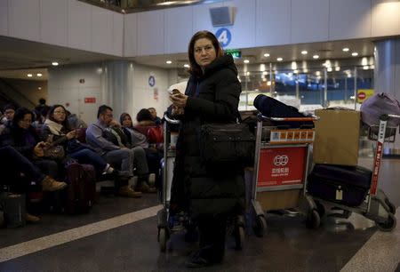 Ursula Gauthier, a reporter for the French current affairs magazine L'Obs, waits at Beijing international airport before her departure to France, in Beijing December 31, 2015. REUTERS/Kim Kyung-Hoon