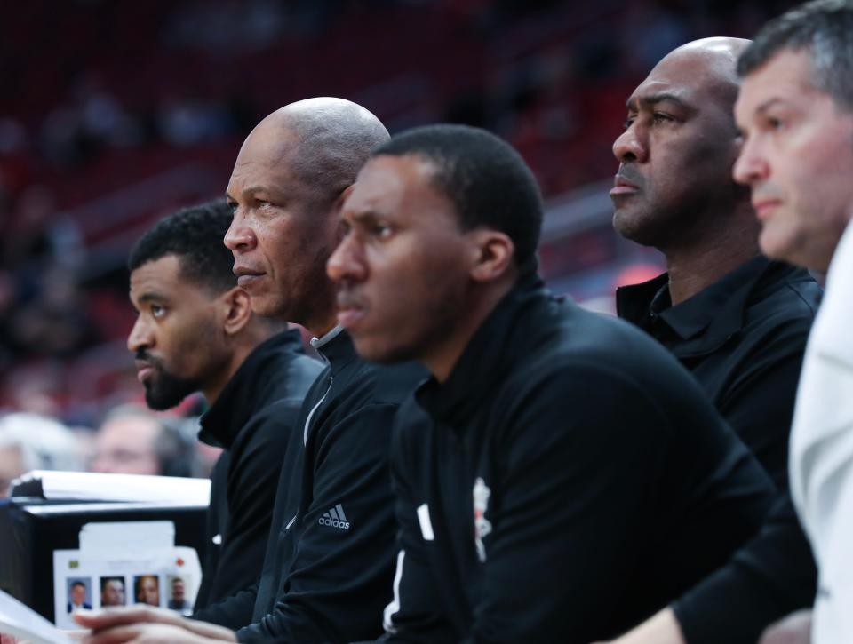U of L head coach Kenny Payne, second from left, and his staff watch action during their game against Notre Dame at the KFC Yum! Center in Louisville, Ky. on Feb. 21, 2024.
