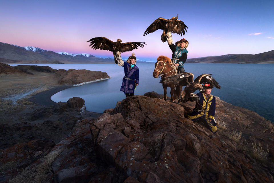 <p>Daniel witnessed the eagle hunters showing their skills via traditional games such as calling from the cliff. (Photo: Daniel Kordan/Caters News) </p>