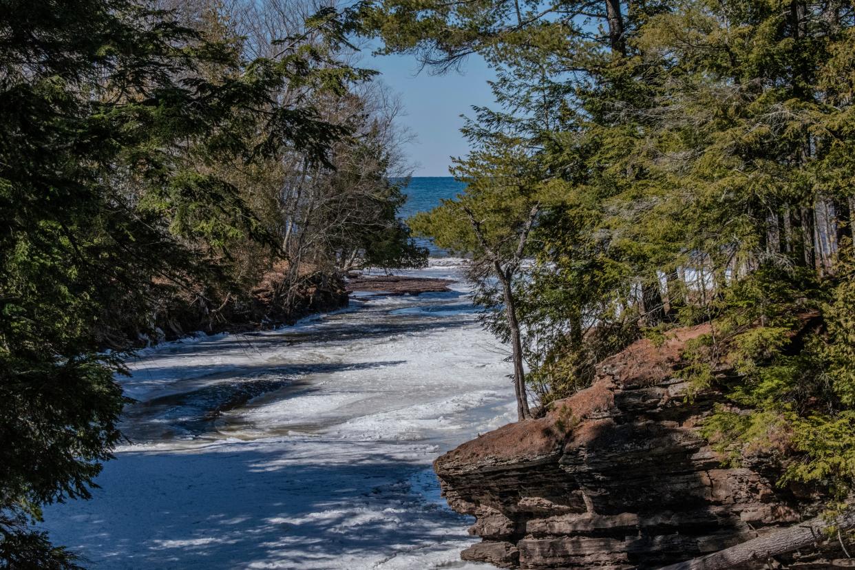 The Presque Isle River in Michigan's Upper Peninsula empties into Lake Superior in the Porcupine Mountain Wilderness State Park. Environmentalists say that a new copper mine, which will be the closest metallic mine to Lake Superior to date, will threaten water quality in Lake Superior and its tributaries.