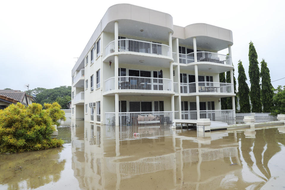 Townsville flooding: Entire levels of an apartment complex sit under the surface of the flood water. Source: AFP