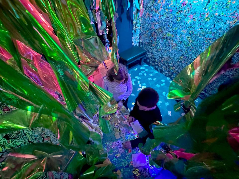 Children explore the Deep Lake Future immersive adventure in the Var Gallery, 700 S. 5th St., on Dec. 18, 2023. The exhibit, open through March, transports visitors of all ages to a surreal underwater future with interactive sculptural elements and hidden passageways where invasive species have overrun the Great Lakes ecosystem.