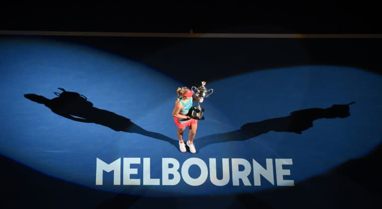 Germany's Angelique Kerber holds The Daphne Akhurst Memorial Cup as she celebrates after Australian Open victory