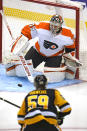 Philadelphia Flyers goaltender Carter Hart stops a shot by Pittsburgh Penguins' Jake Guentzel (59) during the first period of an NHL hockey game in Pittsburgh, Thursday, Nov. 4, 2021. (AP Photo/Gene J. Puskar)