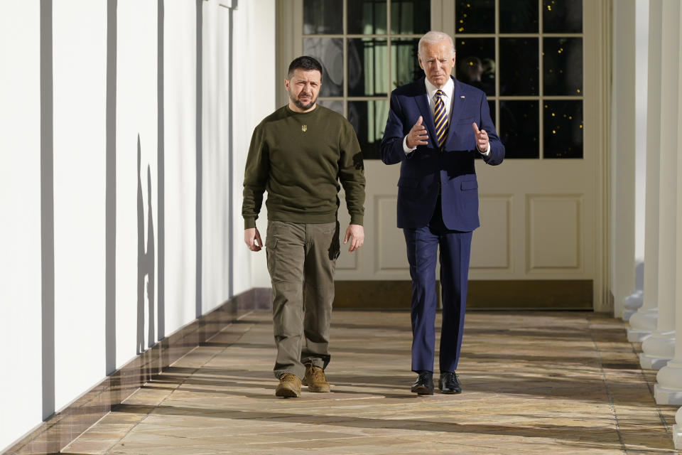 President Joe Biden and Ukrainian President Volodymyr Zelenskyy walk along the Colonnade of the White House, Wednesday, Dec. 21, 2022, in Washington. (AP Photo/Patrick Semansky)
