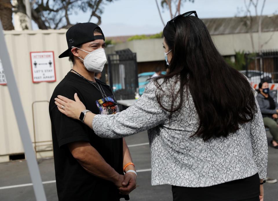 Prosecutor Anastasia Papadakis chats with Teddy Campos, left, at homeless court.