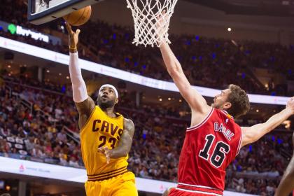 LeBron James shoots over Pau Gasol. (Jason Miller/Getty Images)