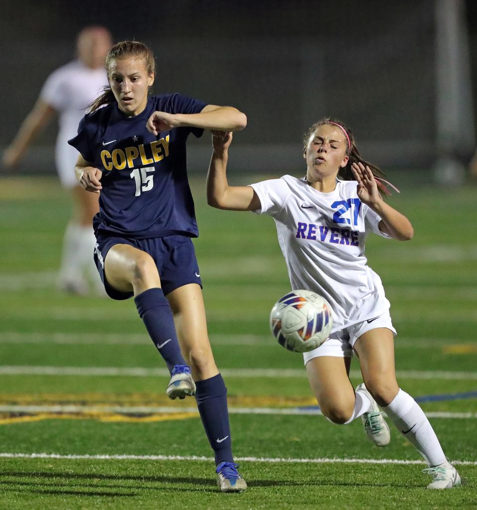 Copley's Kate Young, left, sends the ball downfield past Revere's Hailey Fashinpaur during the first half Wednesday in Copley.