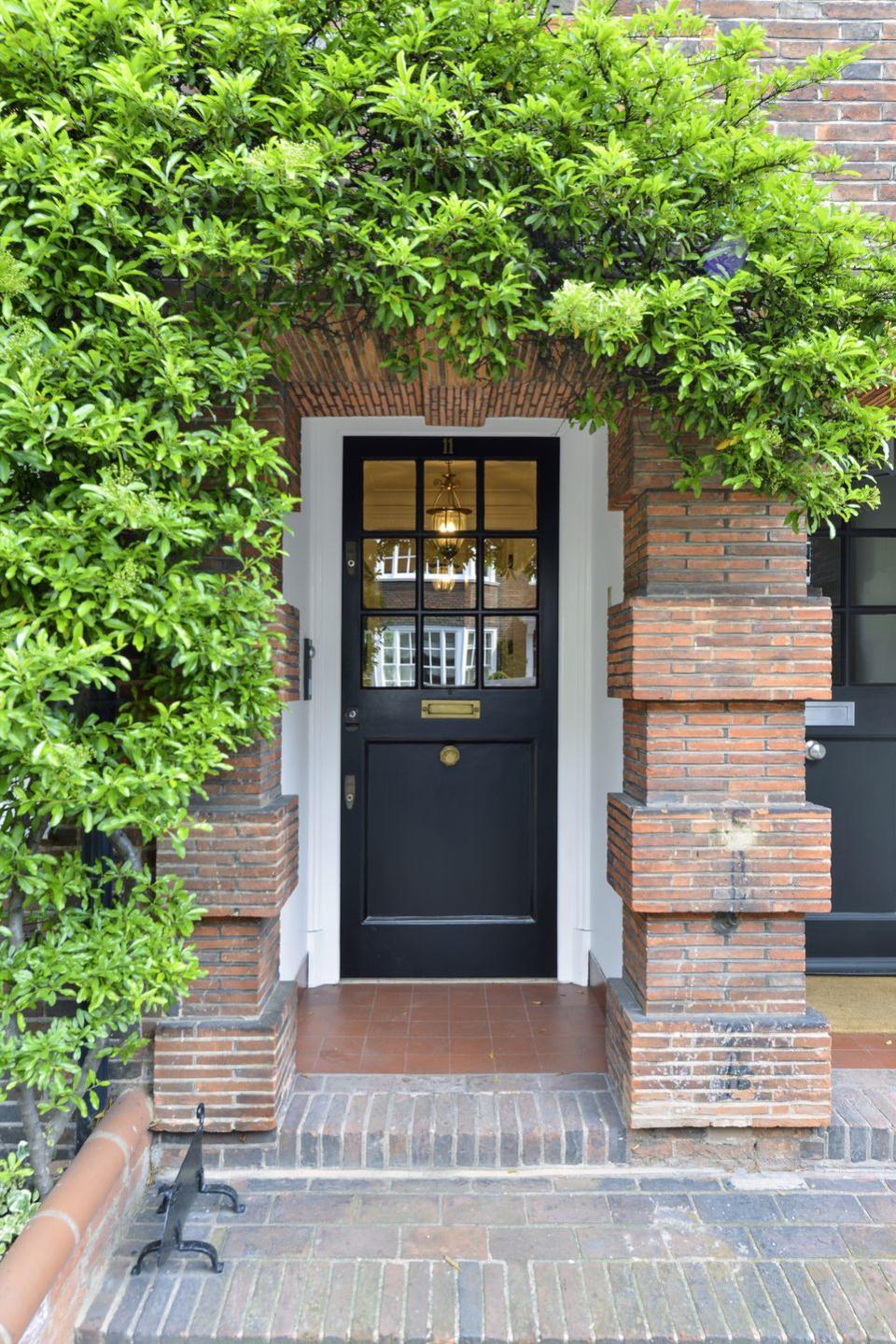 front door with greenery growing