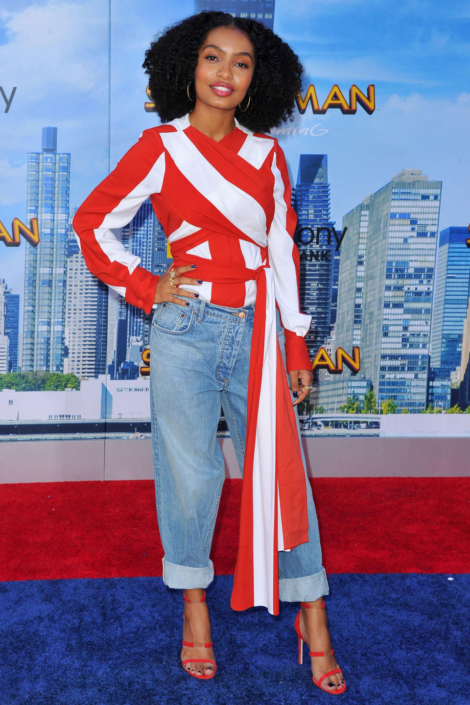 <p><strong>28 June</strong> Yara Shahidi looked chic in a red and white striped top with a draping detail, mom jeans and red strappy heels. </p>