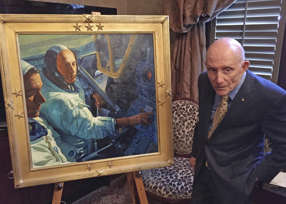 FILE - In this March 22, 2016, file photo, retired NASA astronaut Tom Stafford, a native of Weatherford, Okla.,, who flew the first lunar module to the moon in 1969, stands in front of a portrait made in his honor in the Oklahoma House of Representatives lounge in Oklahoma City. Stafford, who commanded a dress rehearsal flight for the 1969 moon landing and the first U.S.-Soviet space linkup, died Monday, March 18, 2024. He was 93. (AP Photo/Sean Murphy, File)
