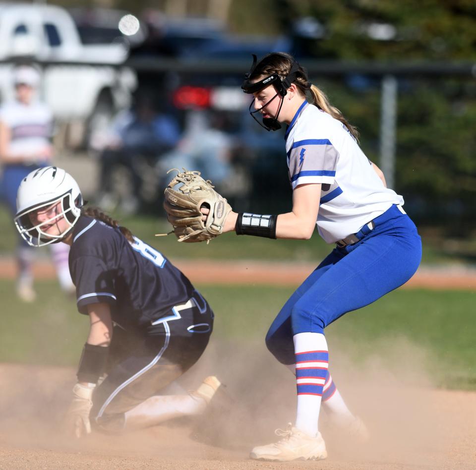 Louisville's Kaitlin Twinem is tagged out by Lake's Olivia Brown in the third inning of Lake at Louisville softball.  Thursday, April 13, 2023.