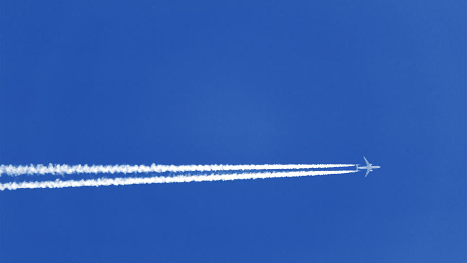 Contrails from a jet airliner dump nitrous oxide into the air. - Credit: Adobe Stock