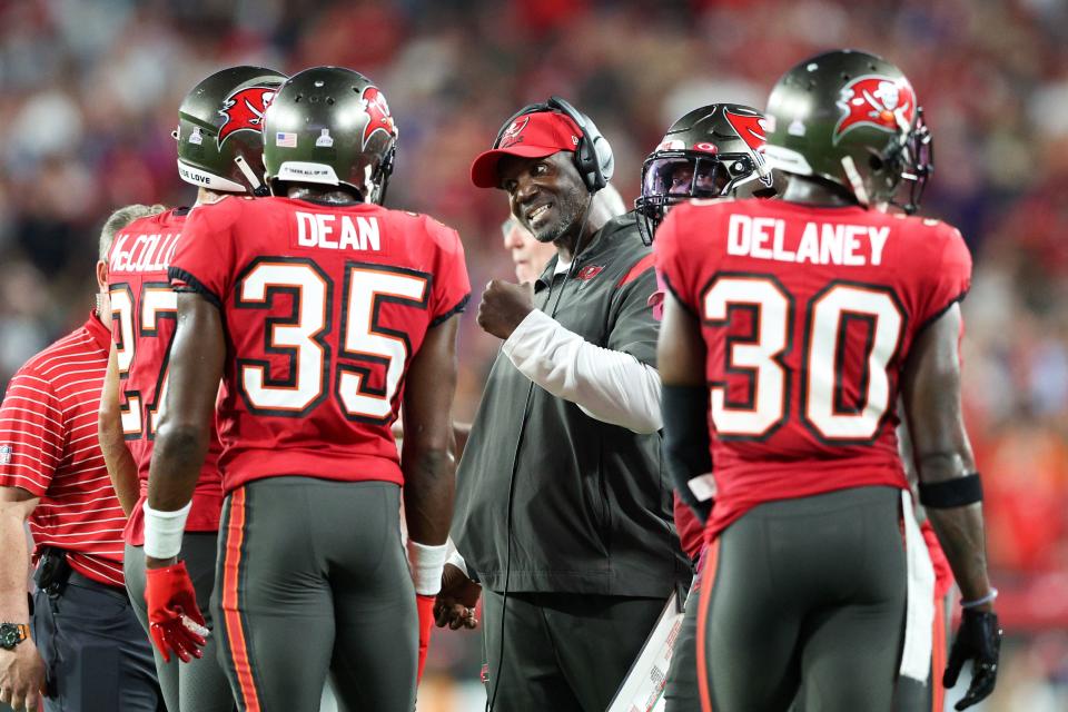 Oct 27, 2022; Tampa, Florida, USA;  Tampa Bay Buccaneers head coach Todd Bowles speaks to cornerback Jamel Dean (35) during a time out against the Baltimore Ravens in the second quarter at Raymond James Stadium. Mandatory Credit: Nathan Ray Seebeck-USA TODAY Sports