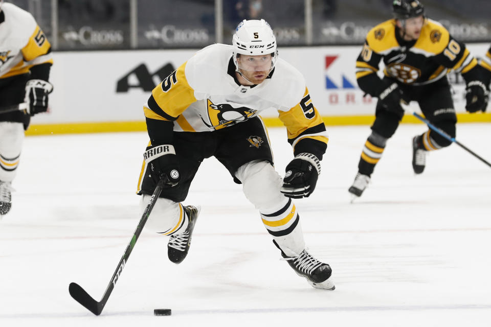 FILE - Pittsburgh Penguins' Mike Matheson plays during the second period of an NHL hockey game against the Boston Bruins in Boston, in this Thursday, April 1, 2021, file photo. In a way, the NHL's COVID-19 protocols may have been a blessing to the Pittsburgh Penguins. The rules forced the Penguins to basically hole up in the hotel while on the road, offering them time to build chemistry, one of the main reasons they were able to win their first division title in seven years. (AP Photo/Winslow Townson, File)