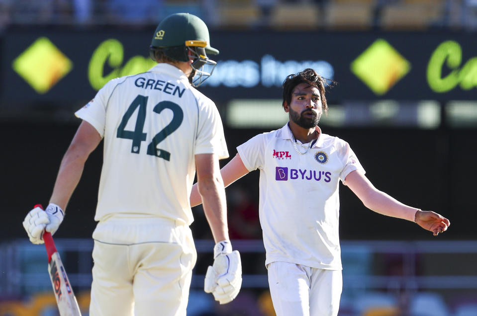 India's Mohammed Siraj, right, reacts after bowling to Australia's Cameron Green during play on the first day of the fourth cricket test between India and Australia at the Gabba, Brisbane, Australia, Friday, Jan. 15, 2021. (AP Photo/Tertius Pickard)