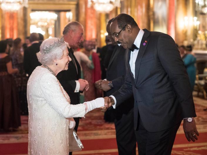 Queen Elizabeth II greets Prime Minister of Antigua and Barbuda in the Blue Drawing Room in the Blue Drawing Room at The Queen's Dinner during the Commonwealth Heads of Government Meeting (CHOGM) at Buckingham Palace on April 19, 2018 in London, England.