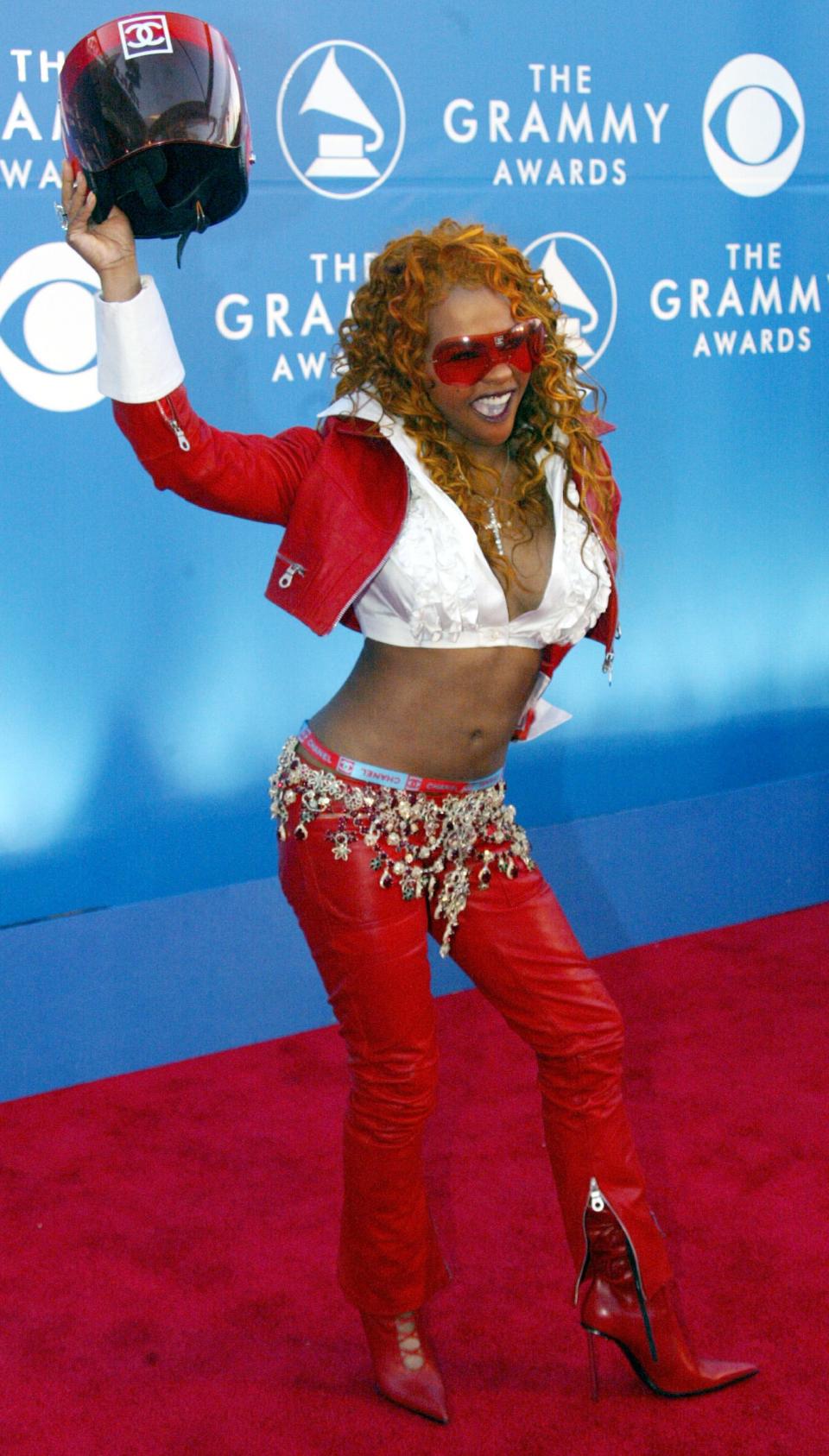 Lil Kim with her Grammy trophy for best pop collaboration with vocals in 2002.