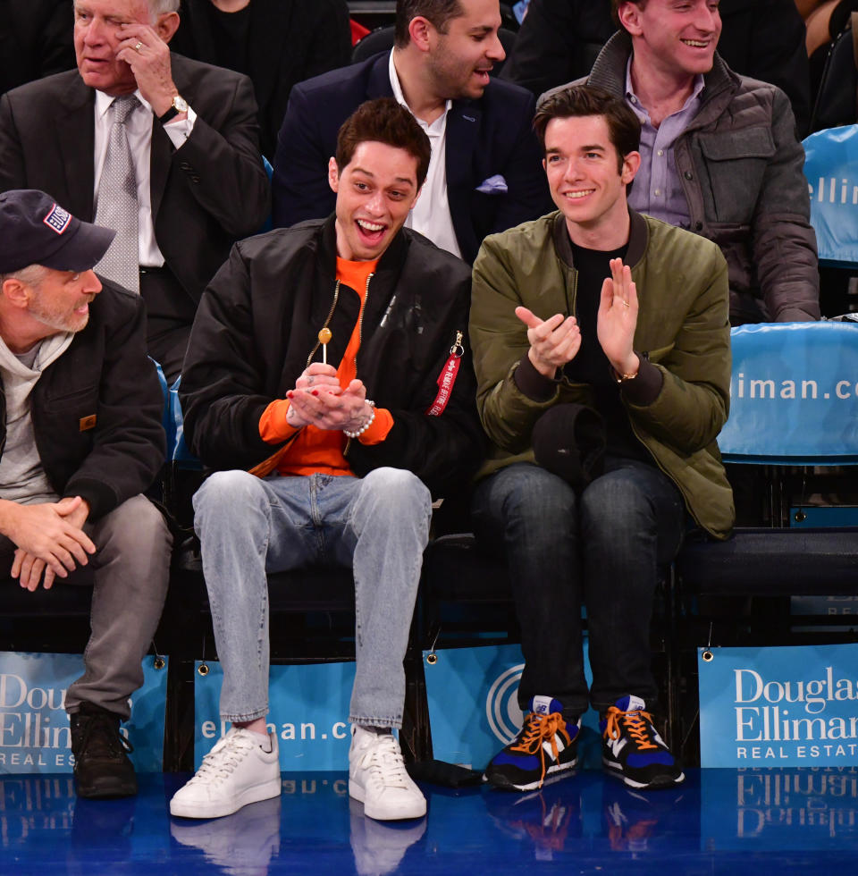 Pete and John sitting front row at a sports event