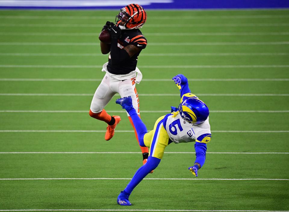 Cincinnati Bengals receiver Tee Higgins makes a catch and runs for a touchdown against Los Angeles Rams cornerback Jalen Ramsey in the third quarter of Super Bowl LVI at SoFi Stadium, Feb. 13, 2022.