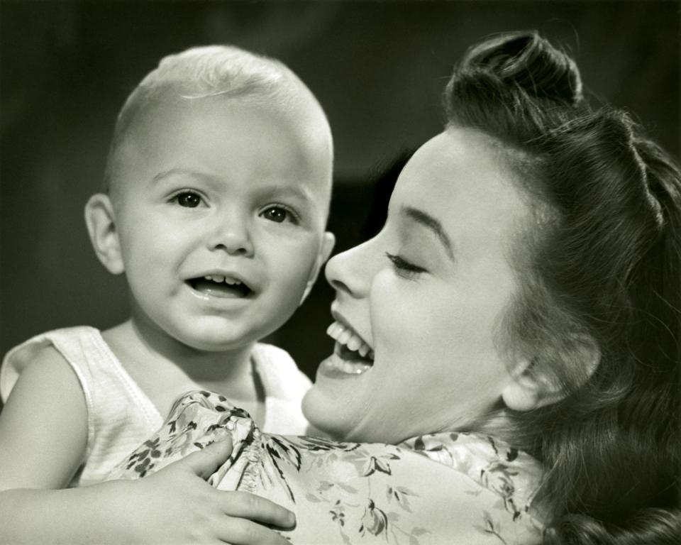 mother holding baby