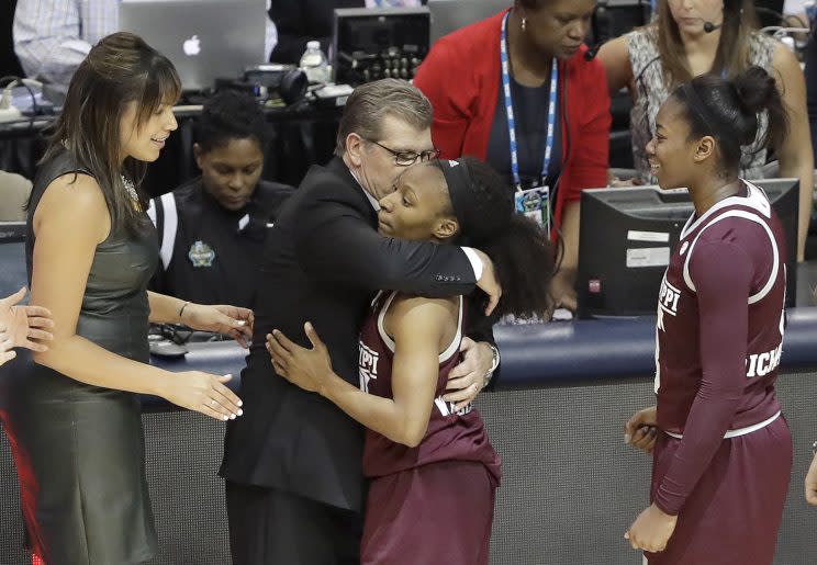 Geno Auriemma embraced Morgan William after the MSU guard beat UConn at the buzzer. (Getty)