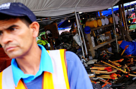 A volunteer stands next to tools to search survivors in a collapsed building, after an earthquake in Mexico City, Mexico September 26, 2017. REUTERS/Nacho Doce