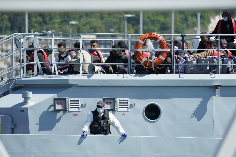 A group of people thought to be migrants are brought in to Dover by Border Force, following a small boat incident in the Channel, in Kent, England, Tuesday June 14, 2022. (Andrew Matthews/PA via AP)