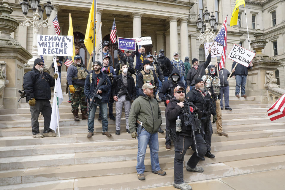 People take part in a protest for "Michiganders Against Excessive Quarantine" at the Michigan State Capitol in Lansing, Michigan, on April 15. (Photo: JEFF KOWALSKY via Getty Images)