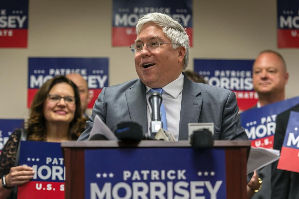 FILE- This June 5, 2018 file photo shows West Virginia Attorney General and GOP Senate candidate Patrick Morrisey at a press conference in Charleston, W.Va. U.S. Sen. Joe Manchin of West Virginia, facing a tough re-election in a state President Trump won by 42 percentage points in 2016, has written a series of op-ed pieces with Republican senators this week as a show of his bipartisan efforts. (Craig Hudson/Charleston Gazette-Mail via AP, File)