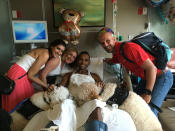 <p>Sydney Corcoran, her mother Celeste Corcoran, and Dave Fortier (L-R), survivors of the Boston bombing, visit with Pulse nightclub shooting survivor Angel Colon (2nd R) with service dogs Koda (L) and Zealand, at Orlando Regional Medical Center in Orlando, Florida, U.S. June 25, 2016. (Orlando Health/Handout via Reuters)</p>