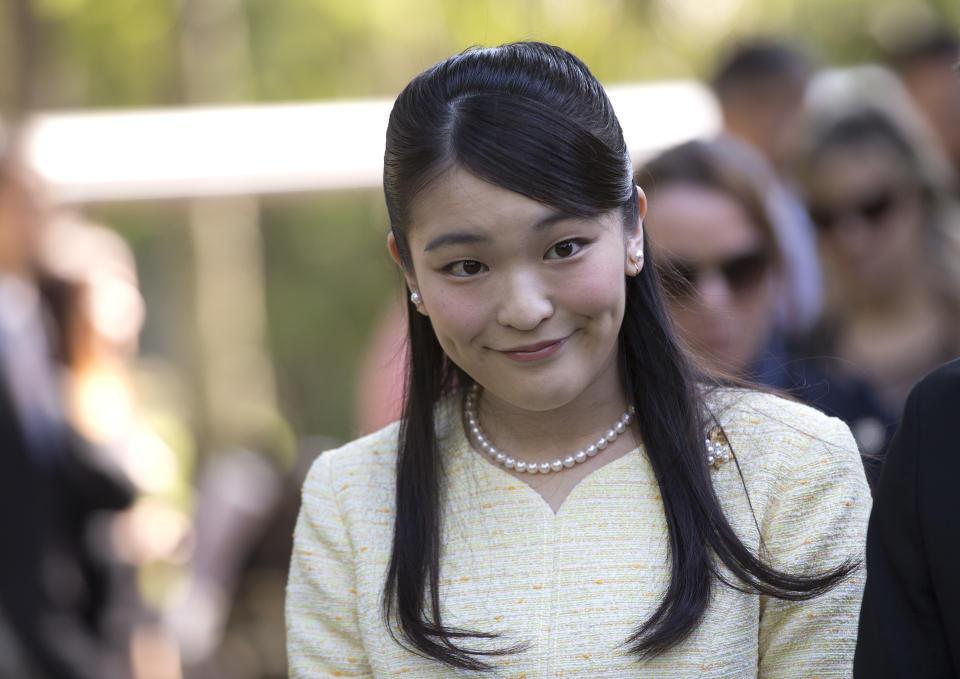 FILE - In this July 18, 2018, file photo, Japan's Princess Mako visits the Botanical Gardens in Rio de Janeiro, Brazil. Japan’s Emperor Akihito, abdicating Tuesday, April 30, 2019, has a relatively small family, and it will shrink in coming years. (AP Photo/Silvia Izquierdo, File)