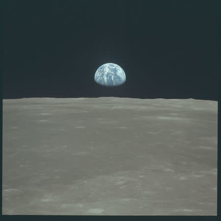 Earth rises above the moon's horizon during the Apollo 11 lunar mission in July 1969. REUTERS/NASA/Handout