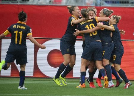 Jun 21, 2015; Moncton, New Brunswick, CAN; Australia forward Kyah Simon (17) is congratulated after scoring a goal against Brazil during the second half in the round of sixteen in the FIFA 2015 women's World Cup soccer tournament at Moncton Stadium. Mandatory Credit: Matt Kryger-USA TODAY Sports