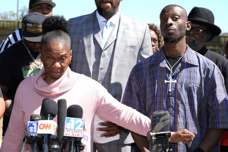 Michael Corey Jenkins, right stands with his mother, Mary Jenkins, as she calls on a federal judge at a news conference Monday, March 18, 2024, in Jackson, Miss., to impose the harshest possible penalties against six former Mississippi Rankin County law enforcement officers who committed numerous acts of racially motivated, violent torture to her son, Michael and a friend Eddie Terrell Parker in 2023. The six former law officers pleaded guilty to a number of charges for torturing them. (AP Photo/Rogelio V. Solis)