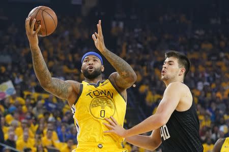 FILE PHOTO: April 15, 2019; Oakland, CA, USA; Golden State Warriors center DeMarcus Cousins (0) receives a pass against LA Clippers center Ivica Zubac (40) during the first quarter in game two of the first round of the 2019 NBA Playoffs at Oracle Arena. Mandatory Credit: Kyle Terada-USA TODAY Sports