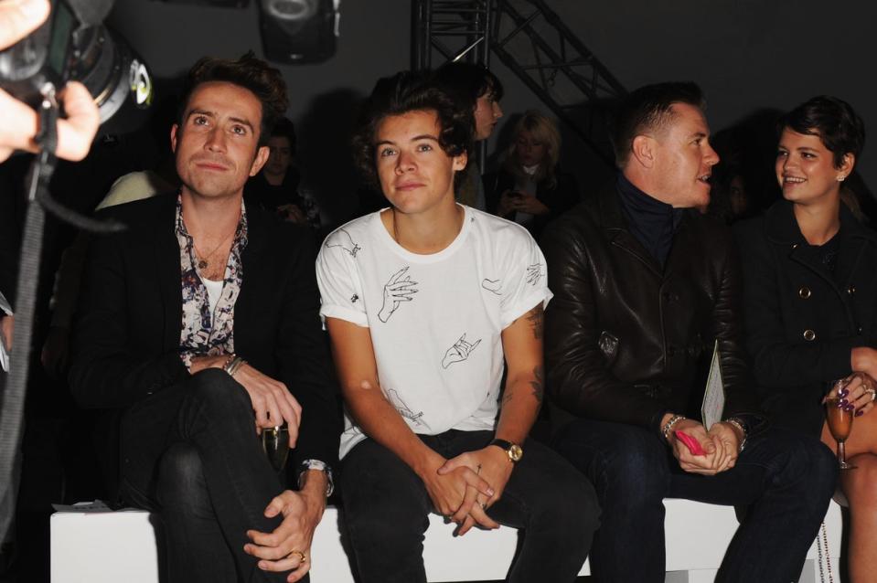 Harry Styles sits front row at London Fashion Week in 2013 (Getty Images)