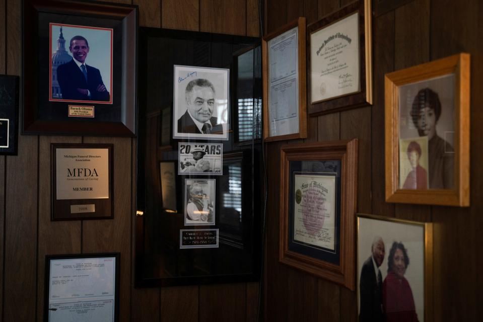 Photographs of historic Black leaders and family members hang on the wall inside an office at Hutchison Funeral Home in Detroit, Monday, Jan. 30, 2023.