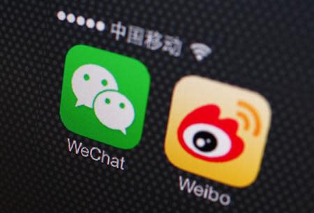 A picture illustration shows icons of WeChat and Weibo app in Beijing, December 5, 2013. REUTERS/Petar Kujundzic